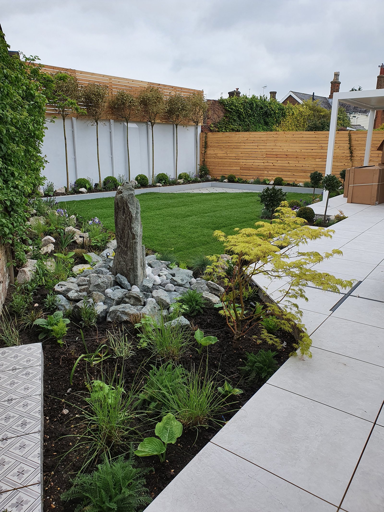 Natural stone retreat garden with lush greenery